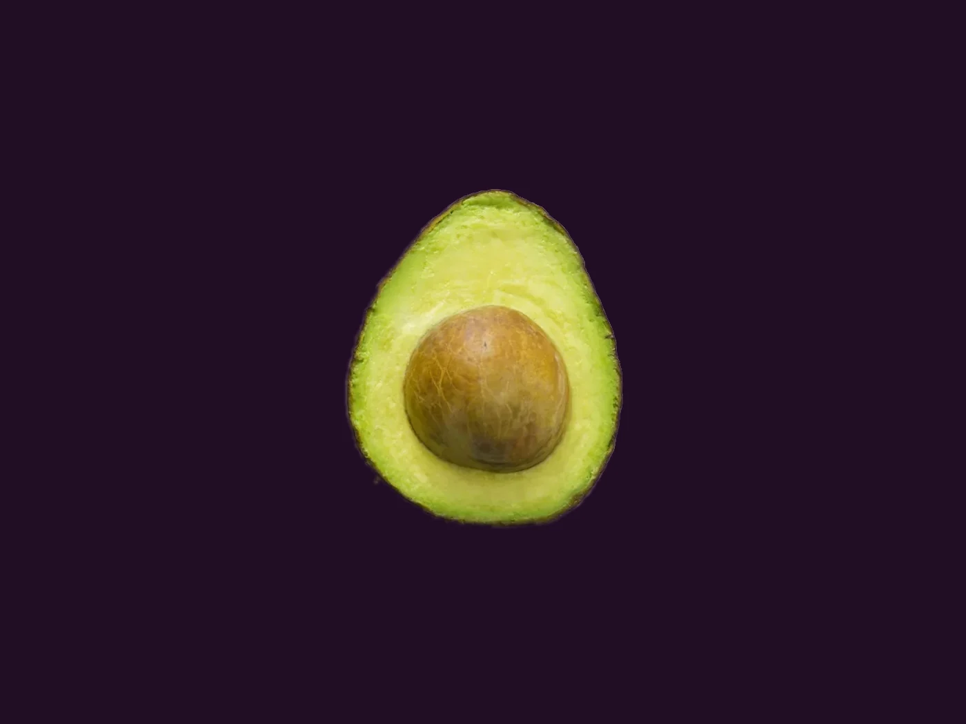Aguacate Hass partido, con la semilla a la vista